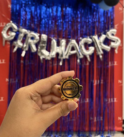 First place awardees of GirlHacks 2023 and their winning token.